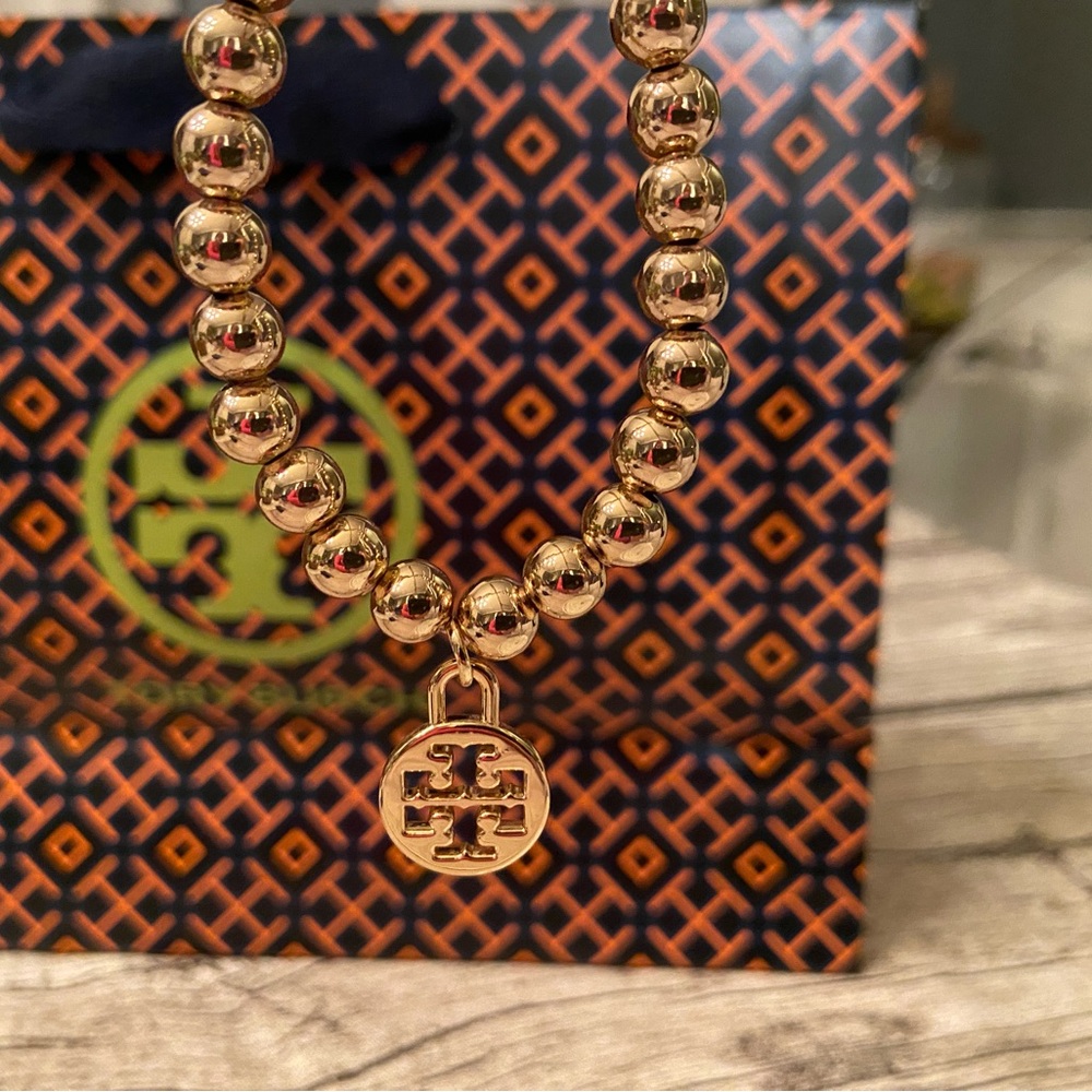 Like New Tory Burch Gold Beaded Charm Bracelet w/ Tory Burch Pouch & Gift Bag - Picture 6 of 6